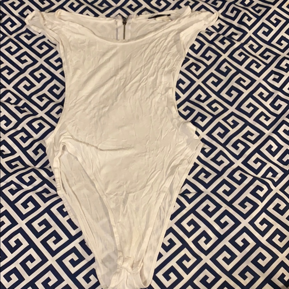White bodysuit showing side boob